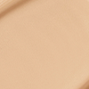 Close-up swatch of a skin-like, glowy foundation in a cool, light sandy-beige shade.