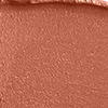 Close-up swatch of a fresh, neutral nude peach lipstick with a matte finish.