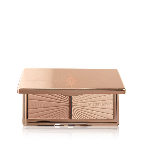 An open, mirrored-lid duo contour palette for light to medium skin tones in sleek rose-gold-coloured packaging. 