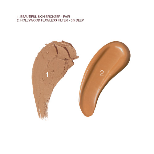 Swatches of a cream bronzer and glowy primer in a dark brown colour.