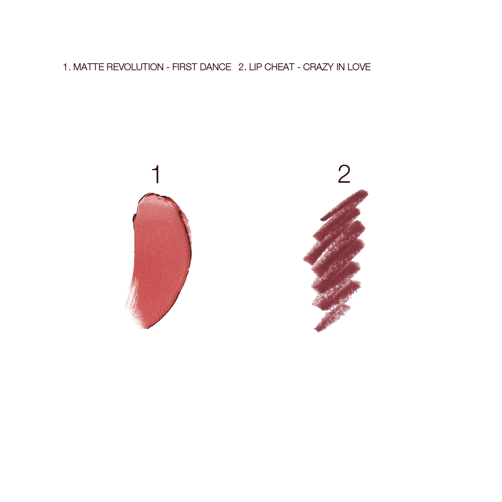 Swatches of a matte lipstick in a warm pink shade and lip liner pencil in purplish-red. 