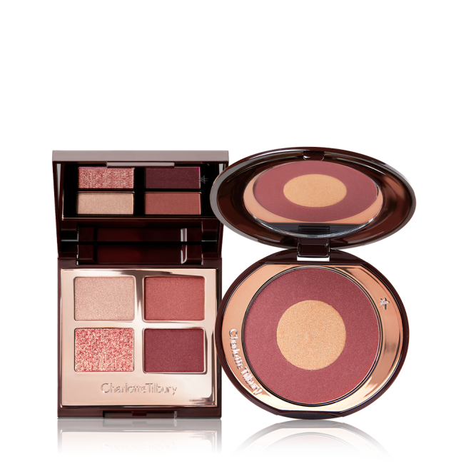 An open, quad eyeshadow palette with shades of cranberry and gold with a matching two-tone blush compact with a mirrored-lid.