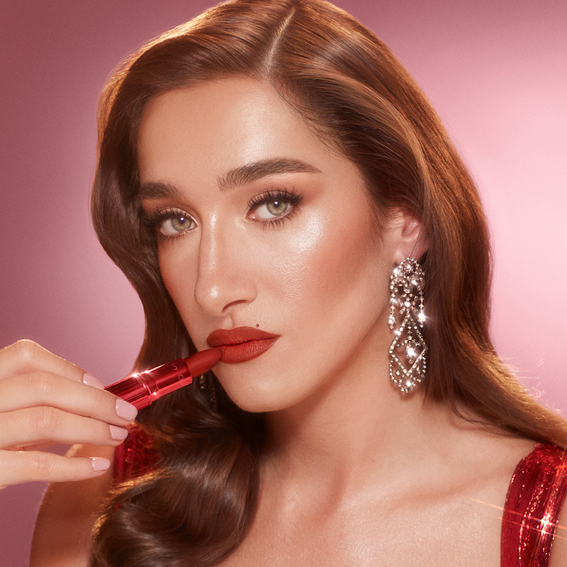 Bella Tilbury wearing Fame Flame matte red lipstick