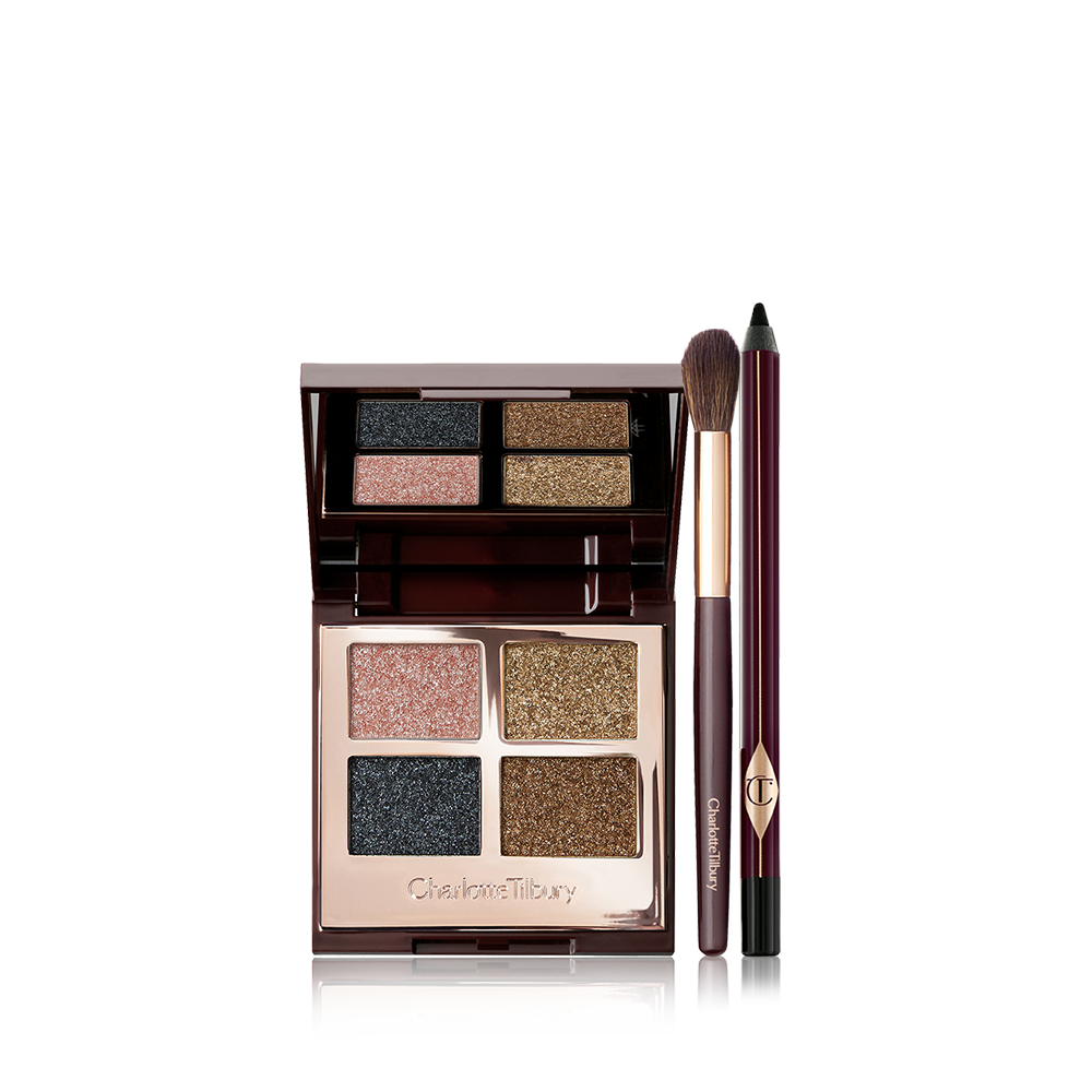 A black eyeliner pencil, quad eyeshadow palette with shimmery rose gold, olive green, teal, and dark brown shades, and an eyeshadow blending brush.