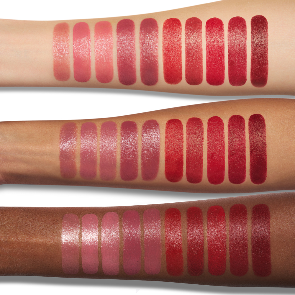 Charlotte's pink and red Hollywood Beauty Icon lipsticks swatched on fair medium and deep skin tones