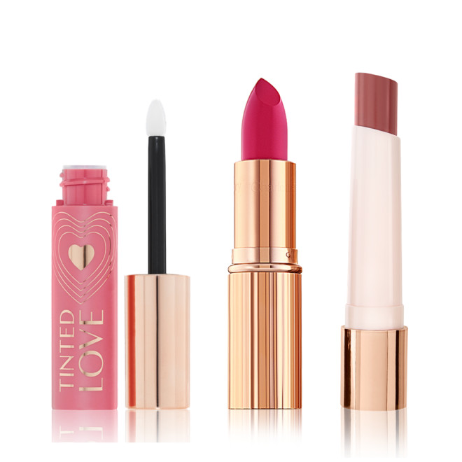 Lips and cheek tint in petal pink with a doe-foot applicator, lipstick in vivid pink in a sleek, gold-coloured tube, and lipstick balm in a reddish brown shade in white and gold-coloured tube. 