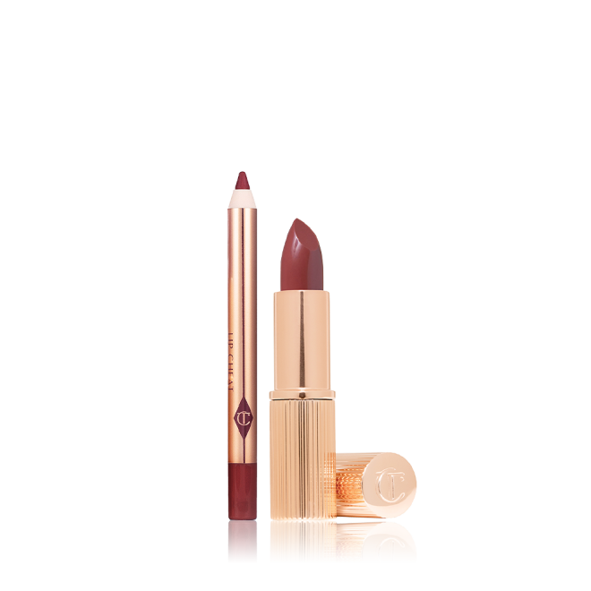 An open mini lipstick in a deep berry-rose pink colour with its lid next to it and a mini lip liner pencil in a matching shade.