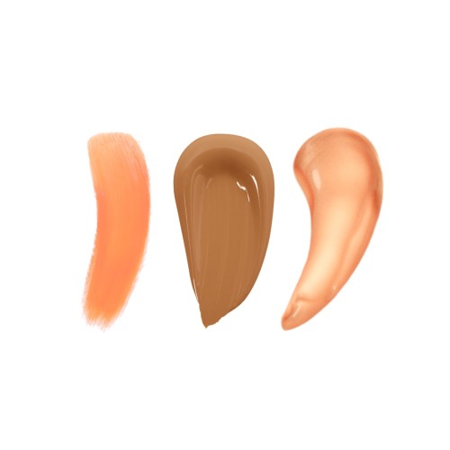 Swatches of eye corrector in peach, foundation in chocolate brown, and primer in a glowy peach shade.