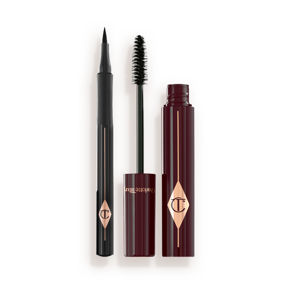 An open mascara with its applicator next to it in dark crimson-cloured packaging and an open eyeliner pen in black colour.