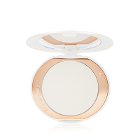 An open, setting powder compact with a mirrored-lid and white and gold-coloured packaging.