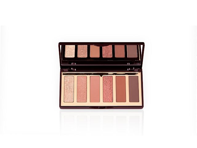 An open, mirrored-lid ., 6-pan eyeshadow palette in shimmery and matte nude shades. 