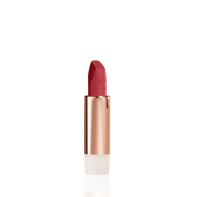 An open, blushed berry-rose lipstick refill in a metallic, golden-coloured tube with its lid next to it. 