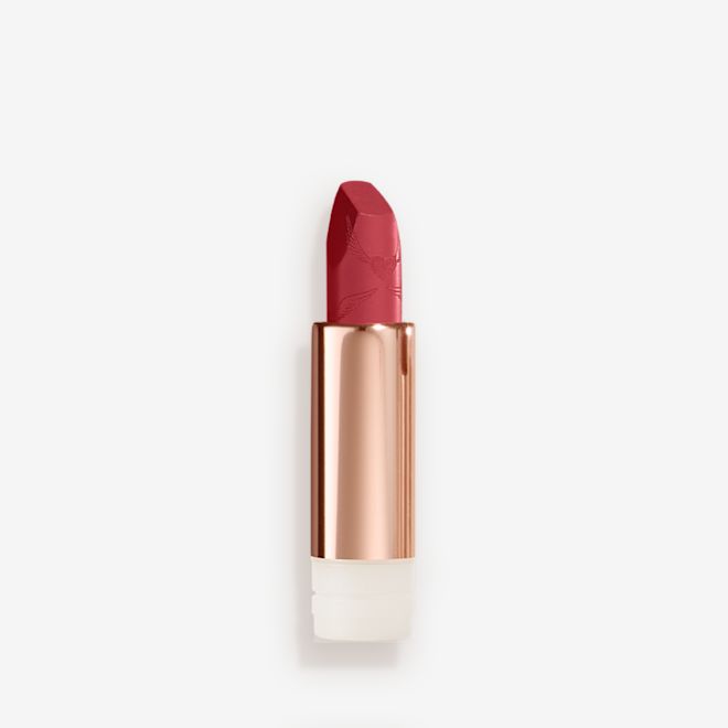 Look of Love Matte Revolution Lipstick Refill in First Dance open An open, blushed berry-rose lipstick refill in a metallic, golden-coloured tube with its lid next to it.