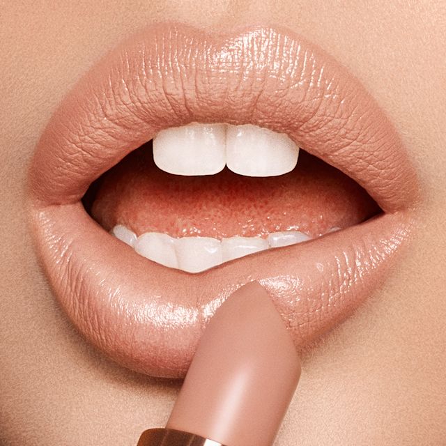 Model with blonde hair wearing Nude Kate Kissing lipstick