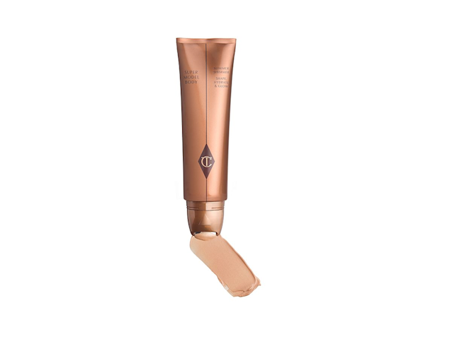 A hydrating body shimmer wand in a champagne-gold shade with identical coloured packaging and a twisting-style applicator. 