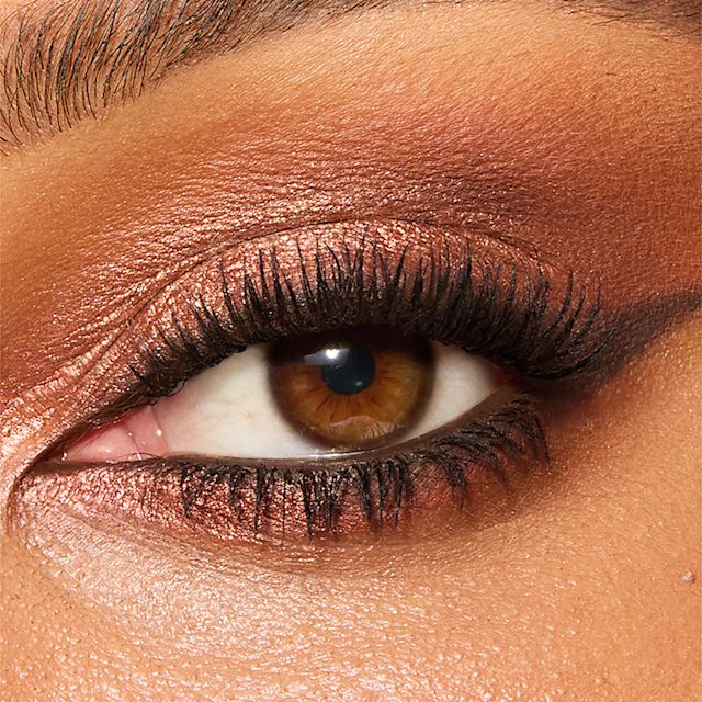 Model eye close up wearing a bronze eyeshadow makeup look using Sensual Sunset eyeshadow palette