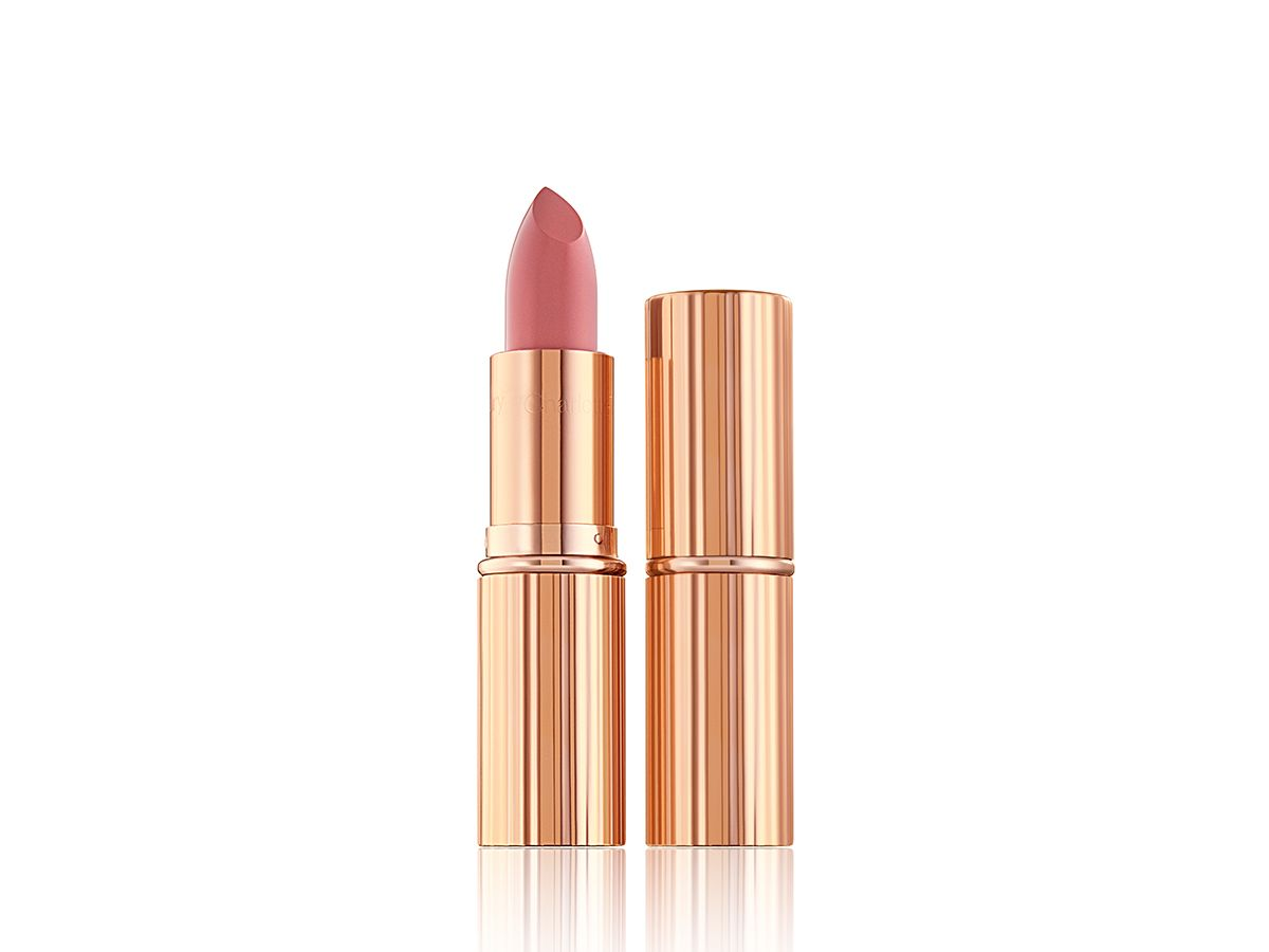 Two lipsticks, with and without lid, in a warm pink matte shade, in golden-coloured packaging.  