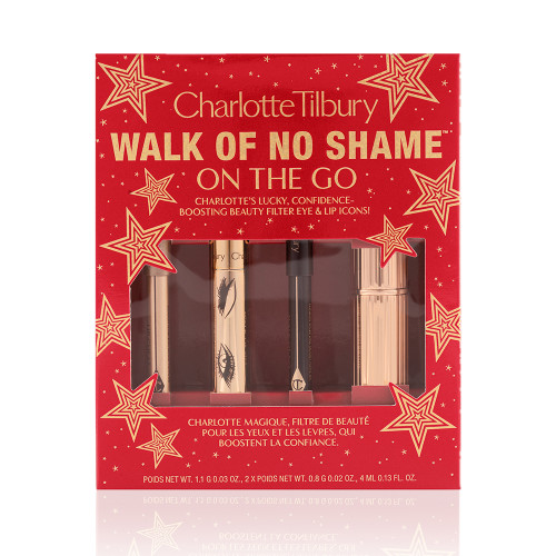 Eyeliner pencil in a berry-pink shade, mascara in a golden-coloured tube, lip liner pencil in berry-red shade, lipstick in a sleek, gold-coloured tube inside a red-coloured gift box with text on it reads, 'Walk of no shame on the go'. 