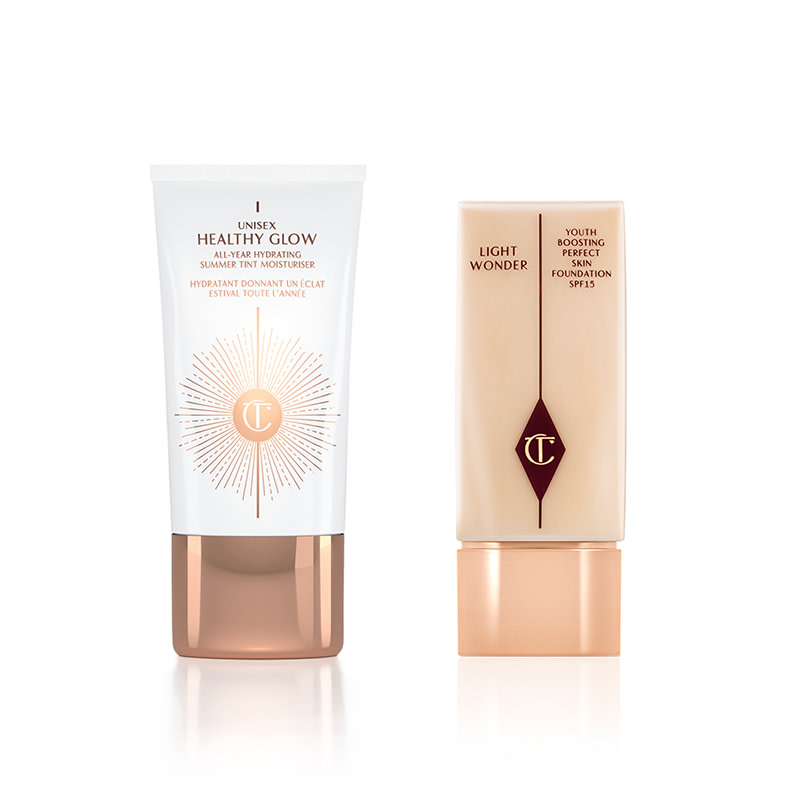 A hydrating tinted moisturiser in white packaging with a light-tone foundation, both with rose-gold coloured caps. 