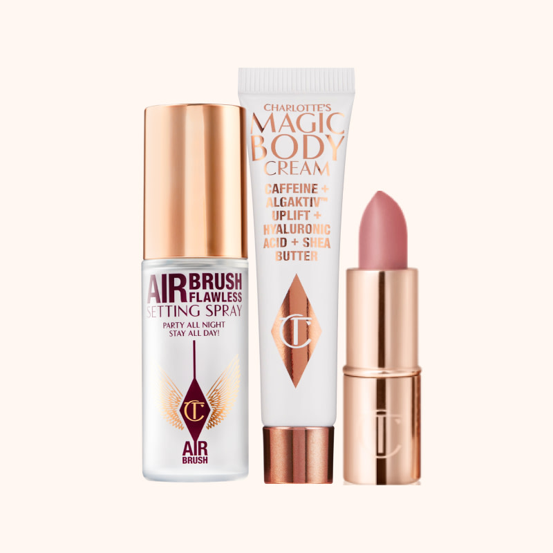 The free beauty gifts available to redeem on CharlotteTilbury.com for a limited time. Mini setting spray, body cream and nude-pink lipstick.