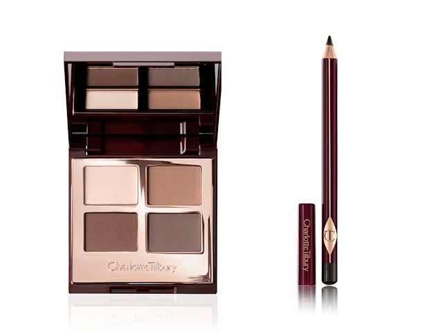 An open, mirrored-lid eyeshadow palette in smokey-grey and earthy tones with an open eyeliner pencil in a classic brown shade. 