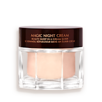 Award-wining, peach-coloured night cream in a large glass jar with a dark brown-coloured lid with Magic Night Cream written on it in gold colour.
