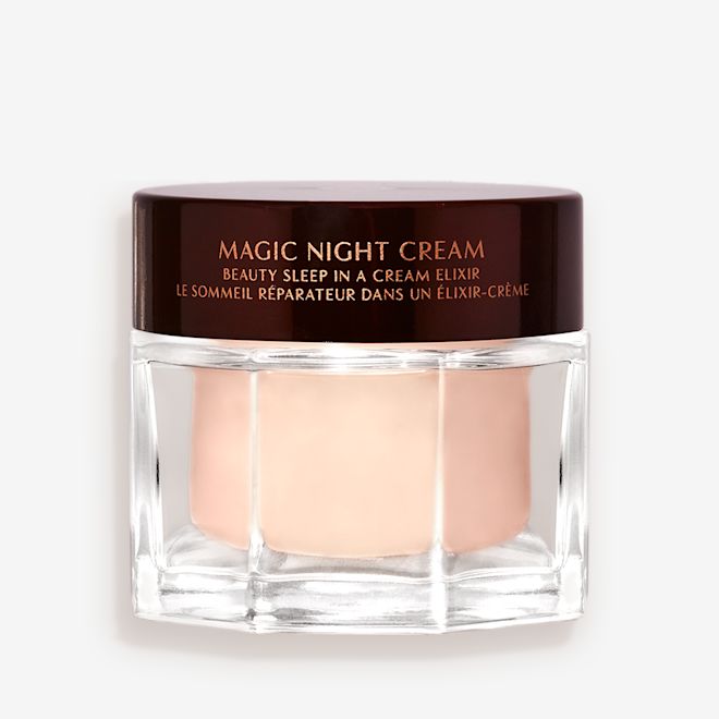Award-Winning Magic Night Cream closed Award-wining, peach-coloured night cream in a large glass jar with a dark brown-coloured lid with Magic Night Cream written on it in gold colour.