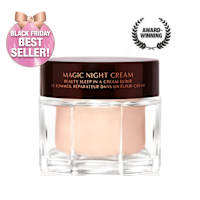 Award-wining, peach-coloured night cream in a large glass jar with a dark brown-coloured lid with Magic Night Cream written on it in gold colour.