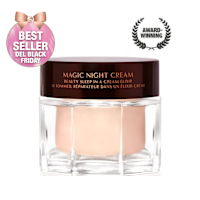 Award-wining, peach-coloured night cream in a large glass jar with a dark brown-coloured lid with Magic Night Cream written on it in gold colour.