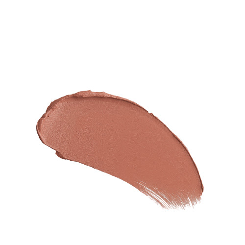 Close-up swatch of a warm, peachy-nude matte lipstick. 