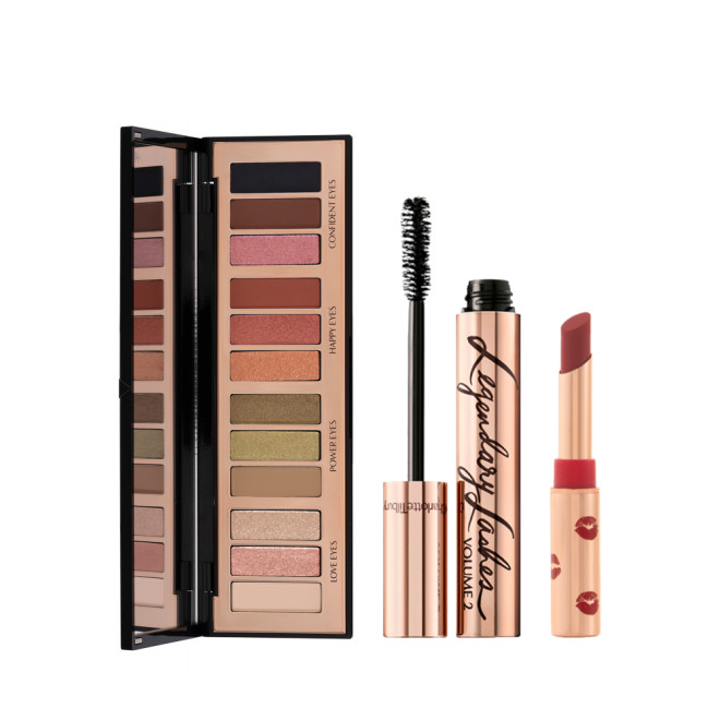 An open, 12-pan eyeshadow palette in matte and shimmery shades beige, pink, silver, green, brown, pink, orange, red, black, black mascara in gold-coloured tube, and maroon lipstick in gold-coloured tube. 