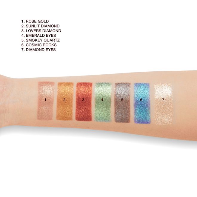 Hypnotising Pop Shots swatches on light-tone arm Light-tone arm with swatches of seven metallic eyeshadows in rose gold, bronze-orange, vibrant red, mint green, lilac-grey, sapphire blue, and opal.