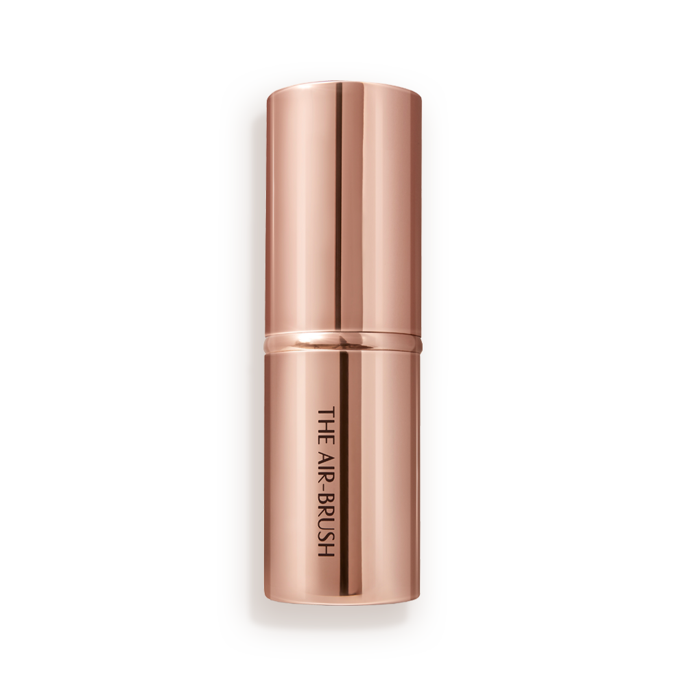 A face blending brush in rose gold packaging.