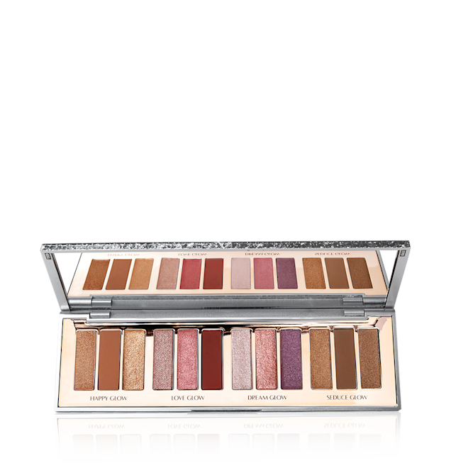 Instant Eye Palette in Bejewelled Eyes to Hypnotise open An open, mirrored-lid eyeshadow palette with twelve metallic and shimmery eyeshadows in topaz, red, purple, chocolate brown, pink and golden shades.