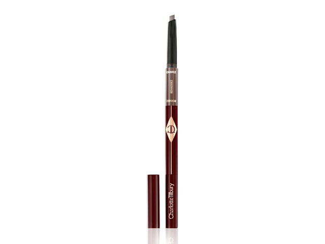 An eyebrow pencil in soft taupe shade with the lid next to it. 