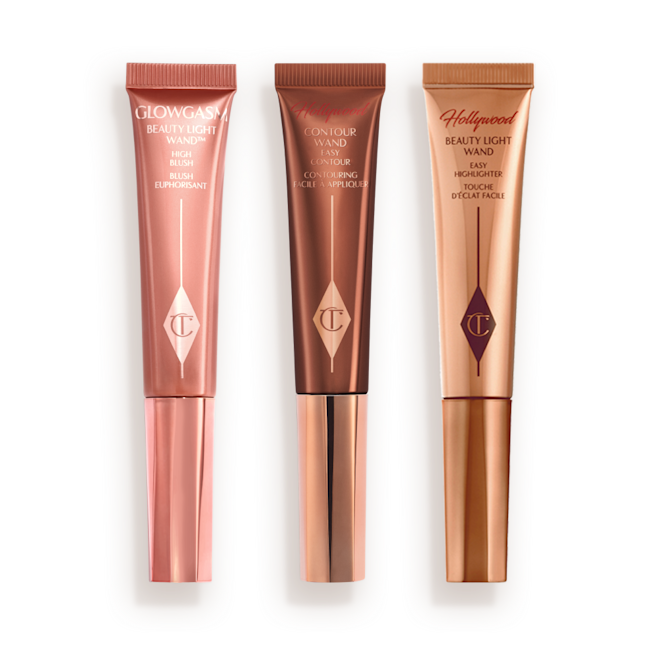 Beauty Light Wands closed Medium-pink liquid blush wand, glowy brown contour wand, and soft candlelight-gold-coloured liquid highlighter wand.