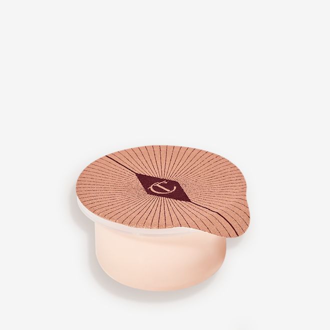 Magic Eye Rescue Refill Refill of a champagne-coloured, thick and luscious eye cream in a petite pot with an easy-to-peel-off cover.