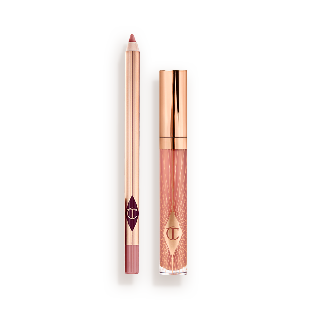 A closed, nude-pink lip gloss with a rose gold lid with an open, nude-pink lip liner pencil with a rose gold body. 