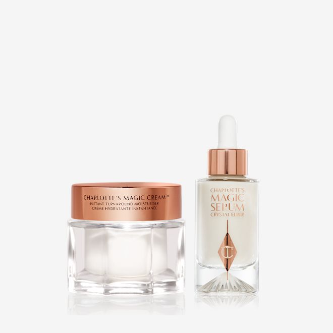 Magic Cream and Magic Serum bundle Luminous, ivory-coloured facial serum in a glass bottle with a white and gold-coloured dropper lid and pearly-white face cream in a glass jar with a gold-coloured lid.