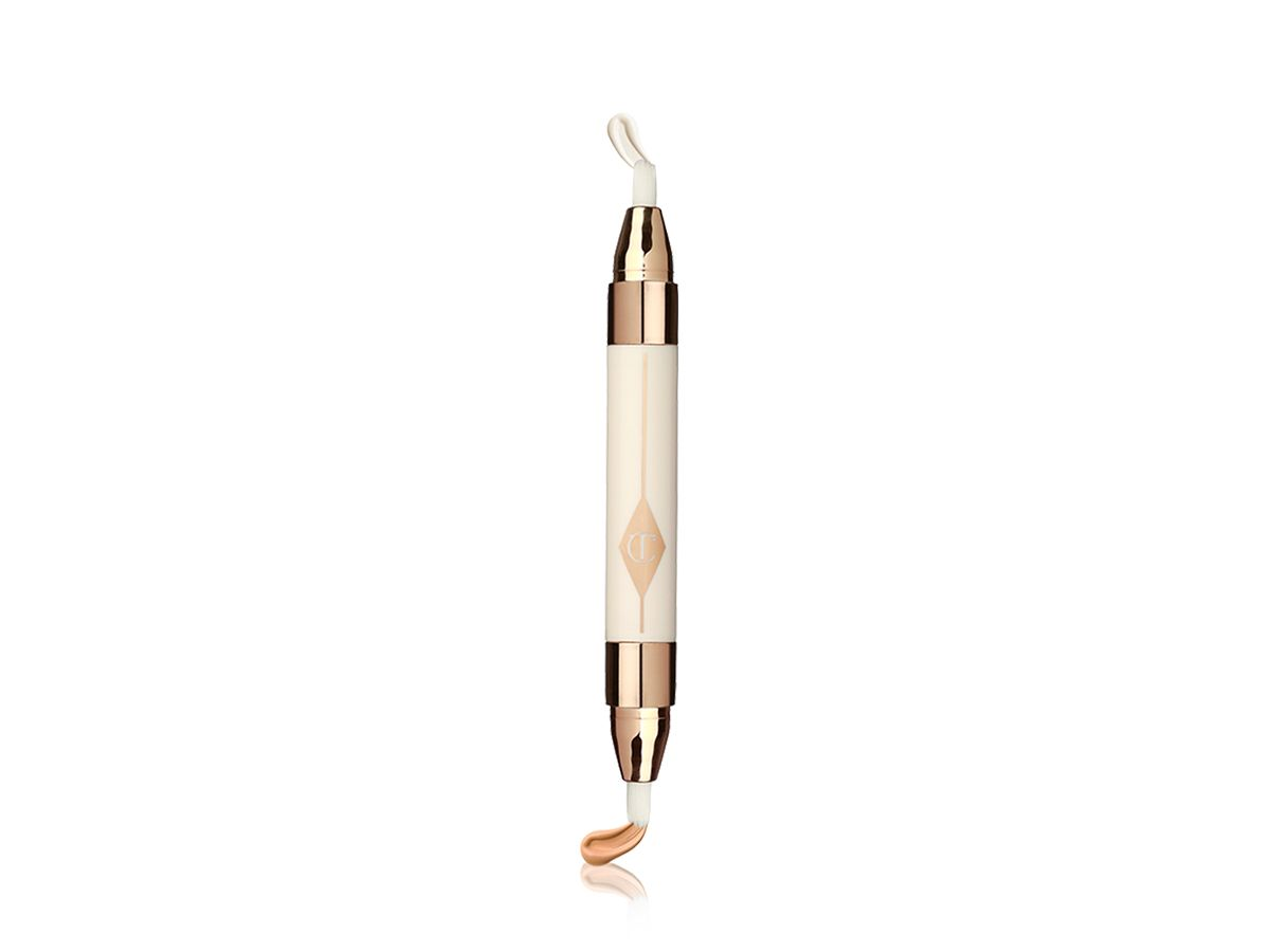 An open, double-sided eye concealer duo in cream and golden-coloured packaging. 