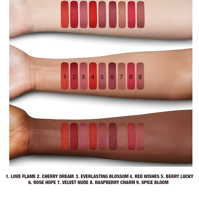 Limitless Lucky Lips collection arm swatches Arm swatches of 5, universally-flattering red-toned lipsticks with a matte finish in shades called, 'Love flame, cherry dream, everlasting blossom, red wishes, and berry lucky'.
