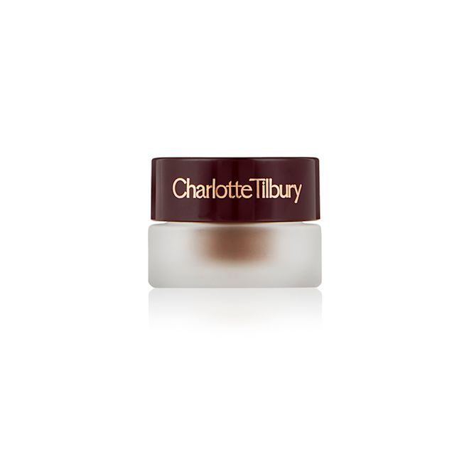 Eyes to Mesmerise in Chocolate Veil closed Frosted glass pot with a cream eyeshadow in a chocolate brown shade with a dark brown lid with Charlotte Tilbury written on the lid in gold.