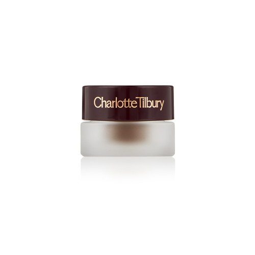 Frosted glass pot with a cream eyeshadow in a chocolate brown shade with a dark brown lid with Charlotte Tilbury written on the lid in gold. 