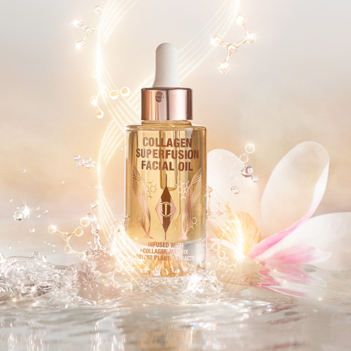 A light-gold-coloured facial oil in a glass bottle with a gold and white-coloured dropper lid, on top of crystal clear water with gold sparkles behind it.