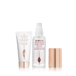 Travel size primer in a white-coloured tube with rose-gold-coloured and a travel-size setting spray in a clear bottle with gold-coloured lid.