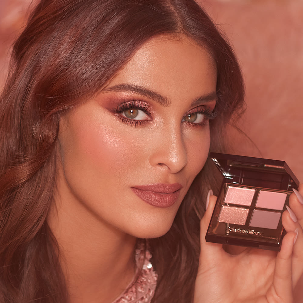 Bruna wearing a beautifully blended eye look using the Pillow Talk Luxury Palette