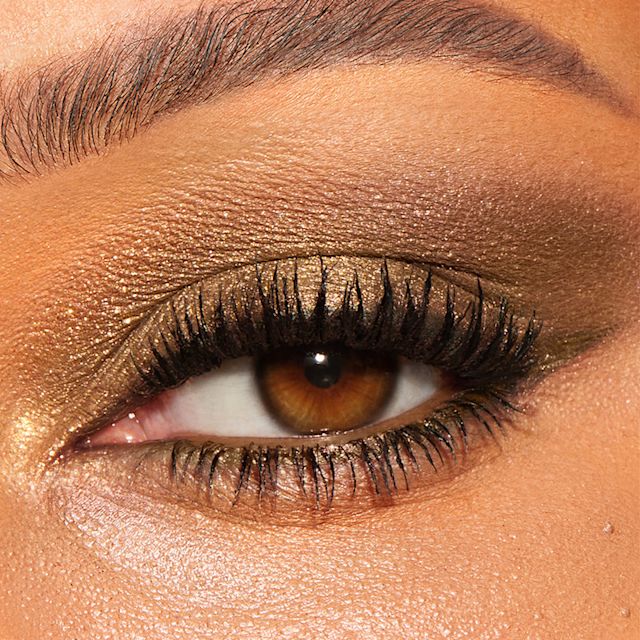 Model with green eyes wearing an Emerald Effect olive green eyeshadow look