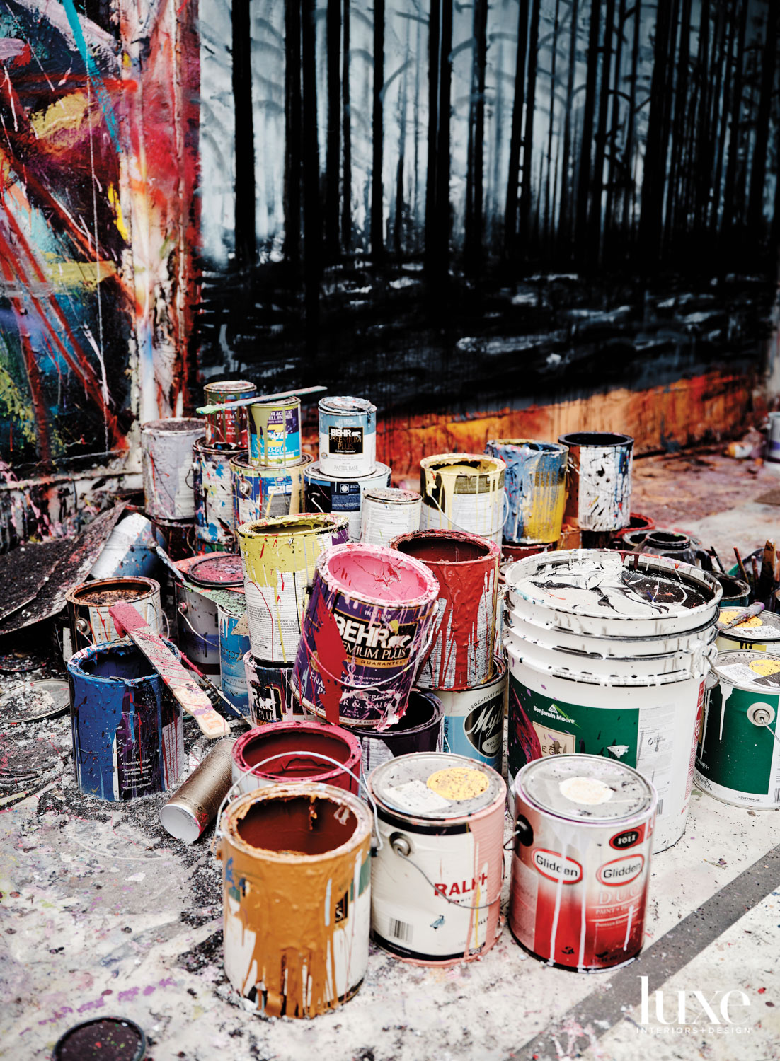 A group of paint cans in the artist's studio.