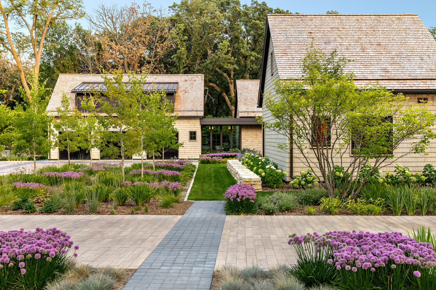 cottage-style home set among a lush landscape in Iowa