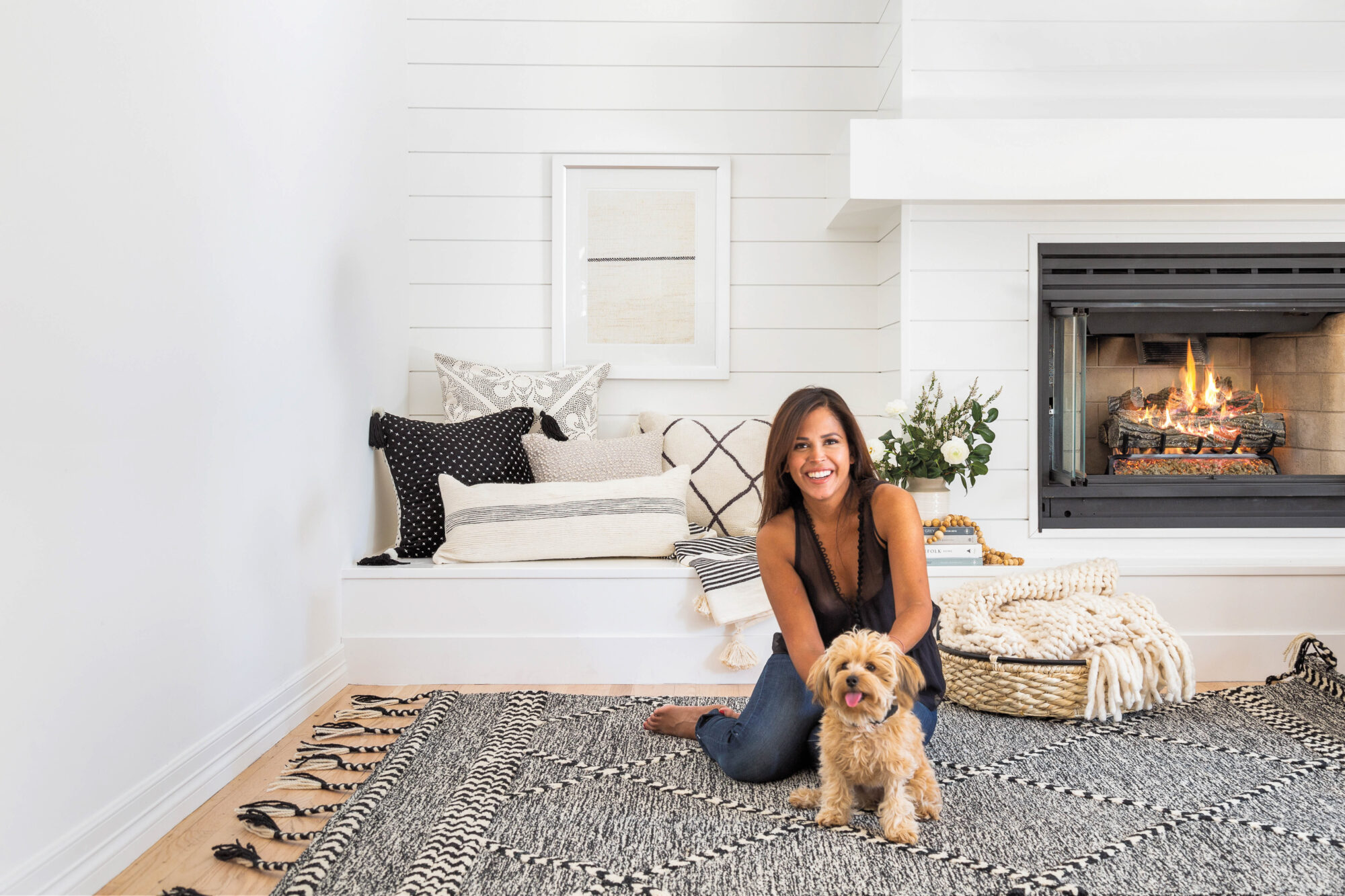 woman on rug with puppy